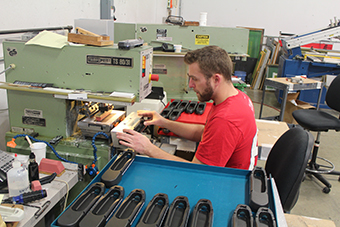 Worker operating a label printing mahine