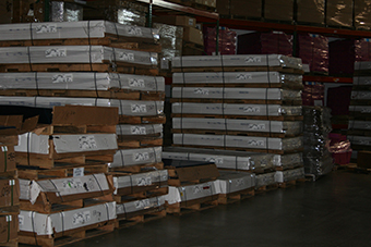 Stacked pallets of raw materials in warehouse